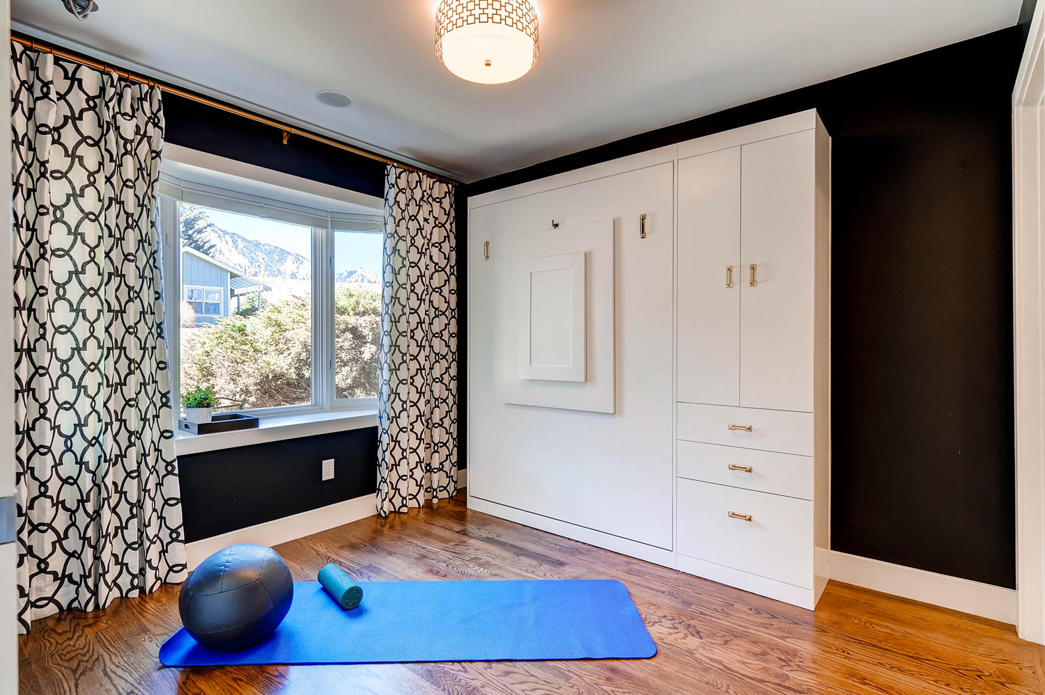 Murphy Bed Folded Up with Workout Gear