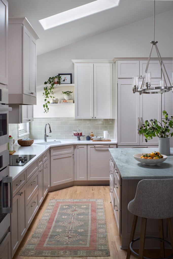 Westminster, golf-community, Aqua Quartzite, island with induction cooktop and vent hood, kitchen renovation, kitchen remodel, full service design, beautiful cabinetry